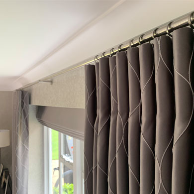 Cartridge pleat curtains with romans blinds